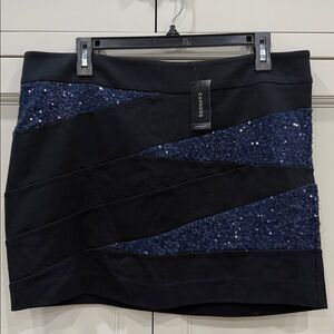 Express NWT black mini skirt with blue sequin panels
Size 12 sparkle metallic